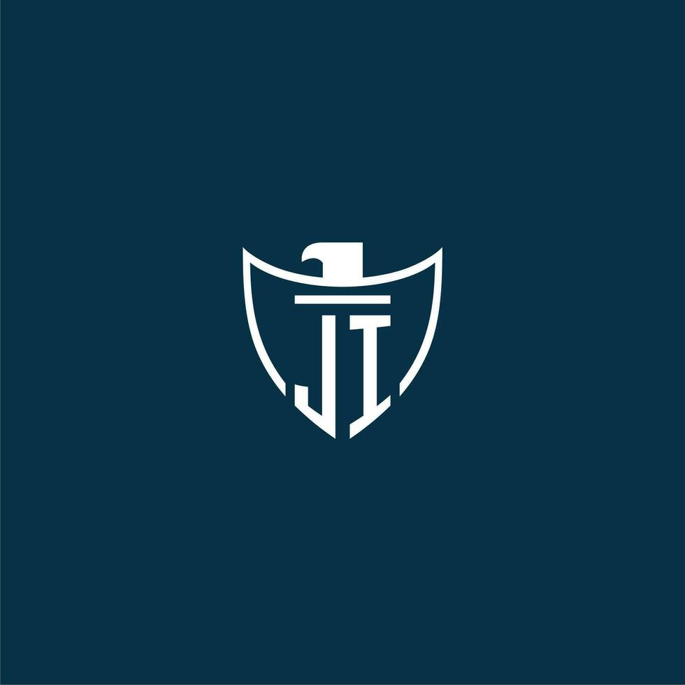 JI initial monogram logo for shield with eagle image vector design
