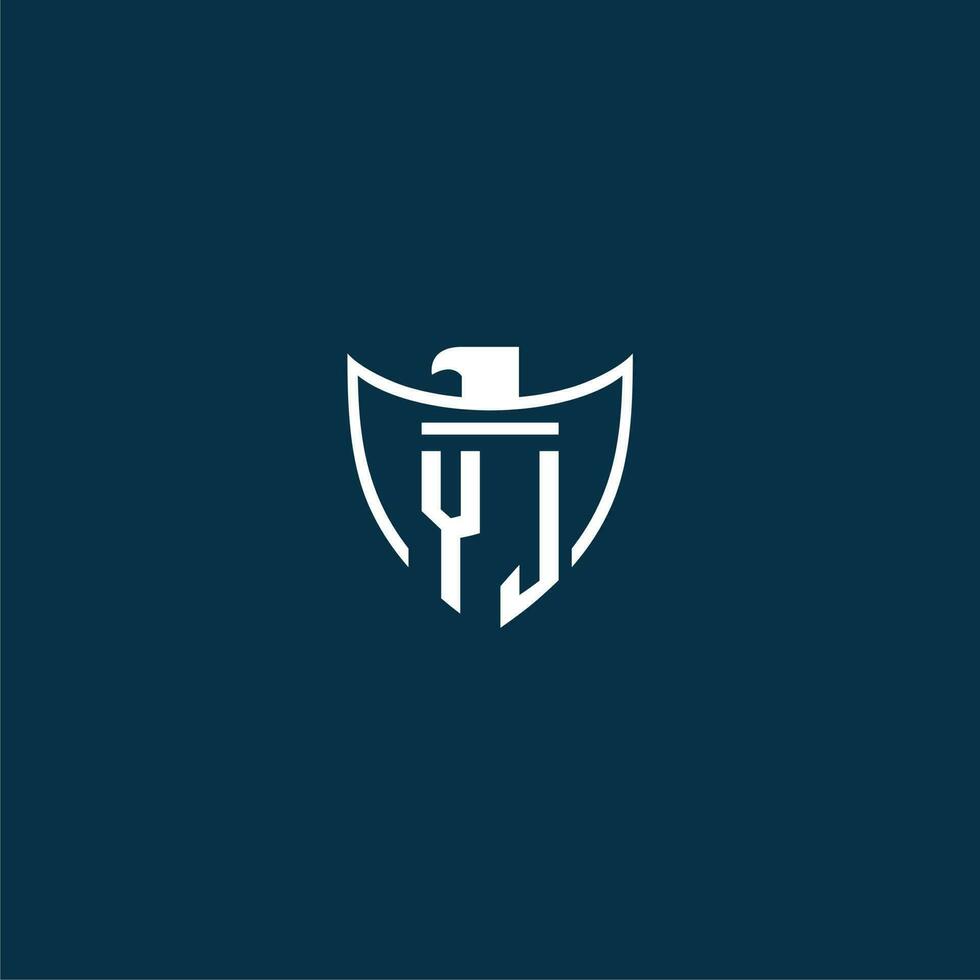 YJ initial monogram logo for shield with eagle image vector design