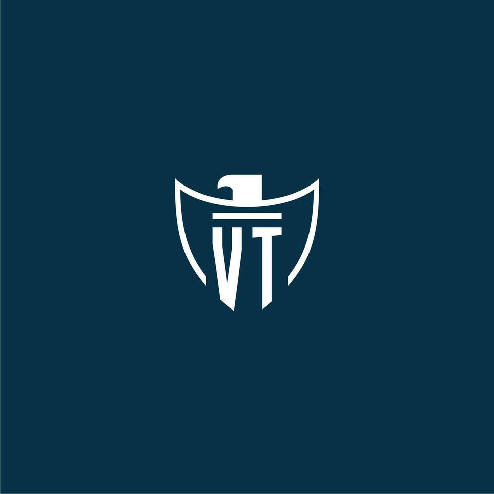 VT initial monogram logo for shield with eagle image vector design