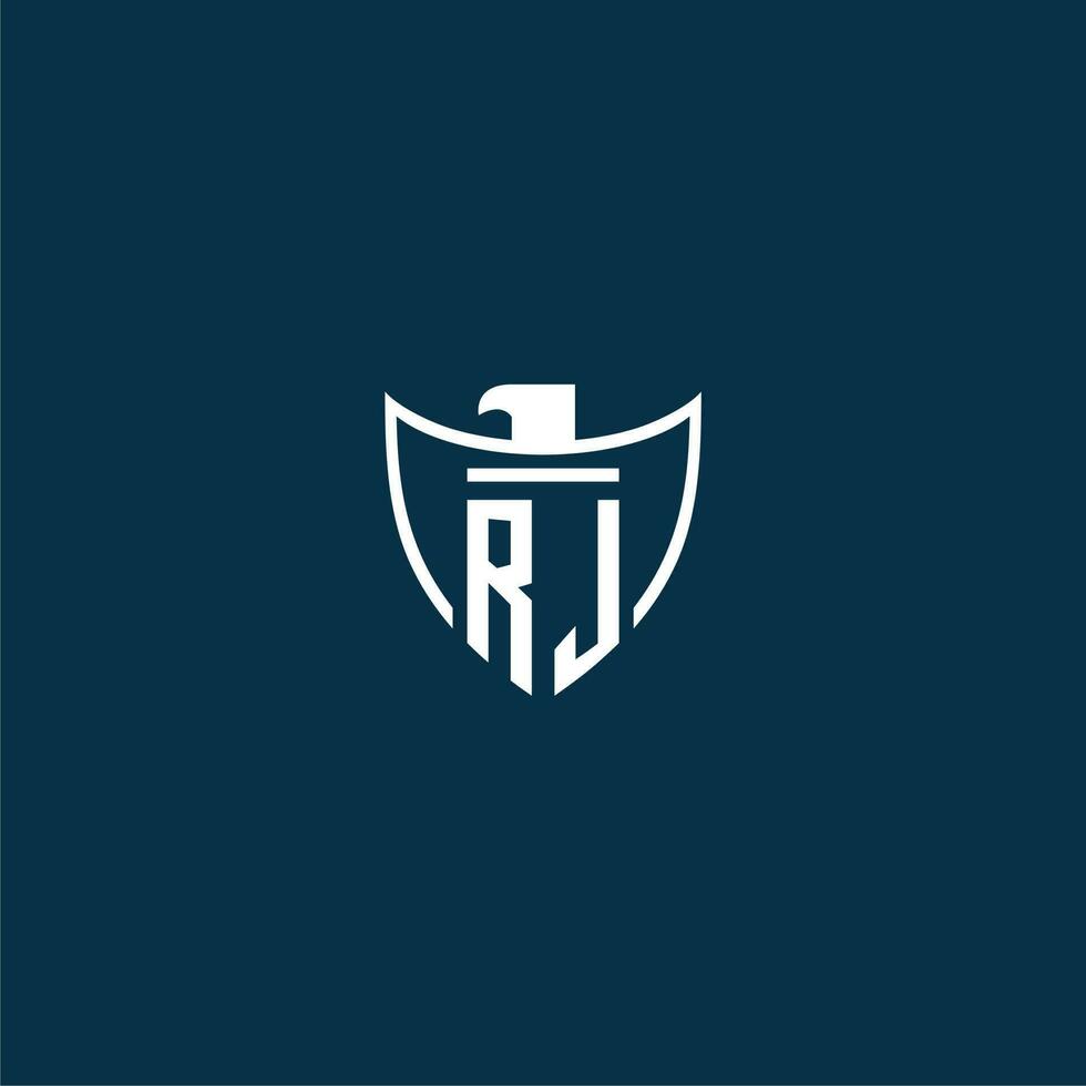 RJ initial monogram logo for shield with eagle image vector design