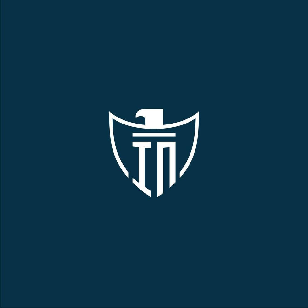 IN initial monogram logo for shield with eagle image vector design