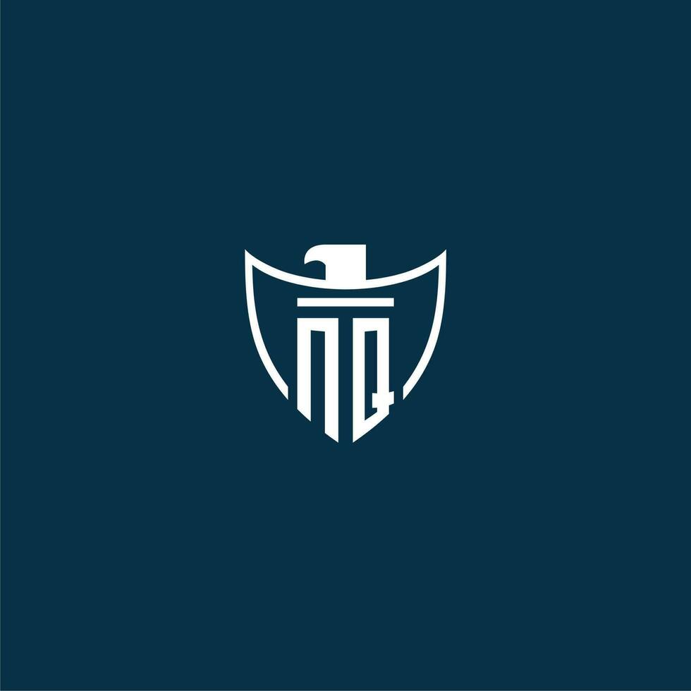 NQ initial monogram logo for shield with eagle image vector design