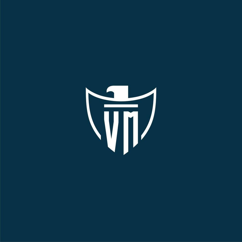 VM initial monogram logo for shield with eagle image vector design