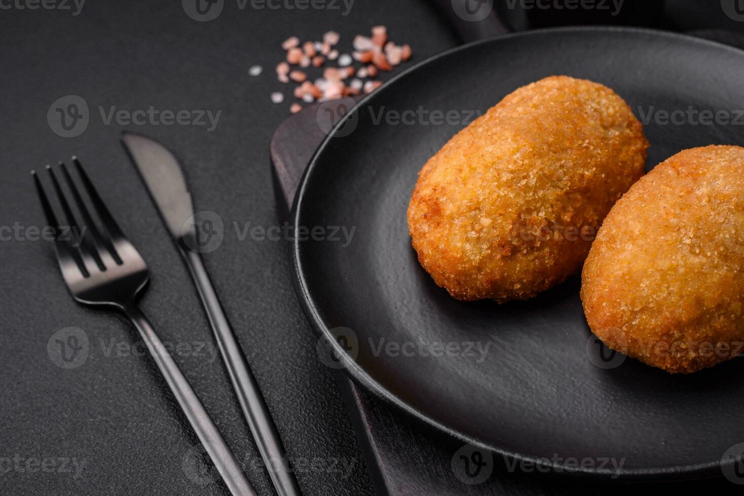 Delicious baked cutlet breaded with spices, salt and herbs photo