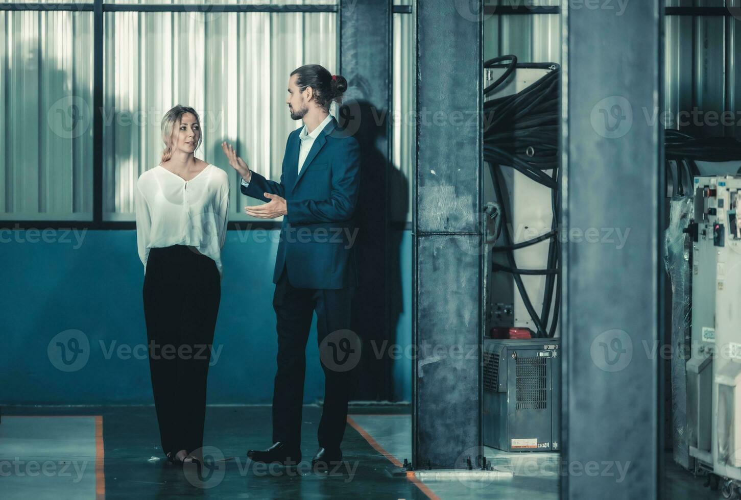 Robotic factory owner explain, discuss functionality and performance of robot systems with client. Answering questions about after-sales service. Price negotiation. Developing long-term relationships photo