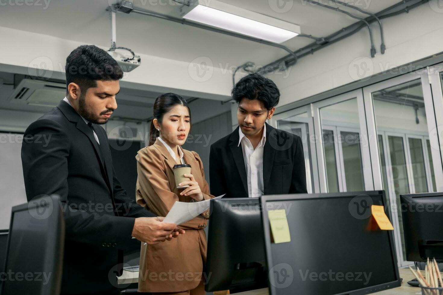 Financial advisors collaborate to assess a company's financial performance using data from its operational activities. Team members work together in a discussions meeting to develop a business plan. photo
