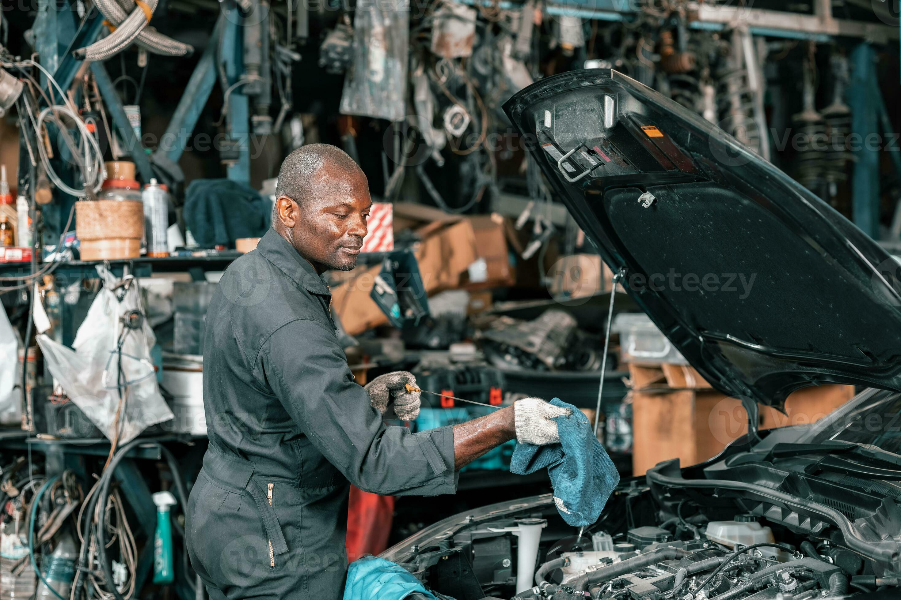 Auto mechanic diagnose and troubleshoots with tools and equipment