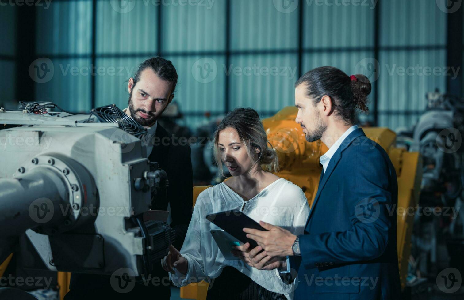 Robotic factory owner explain, discuss functionality and performance of robot systems with client. Answering questions about after-sales service. Price negotiation. Developing long-term relationships photo