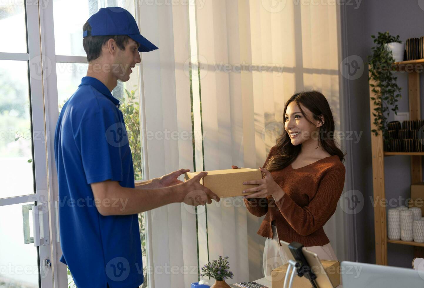 Female vase seller processes orders, including delivery payments, with smartphone and quick response code before sending items to customers. Small business owner work and coordinate with carrier. photo