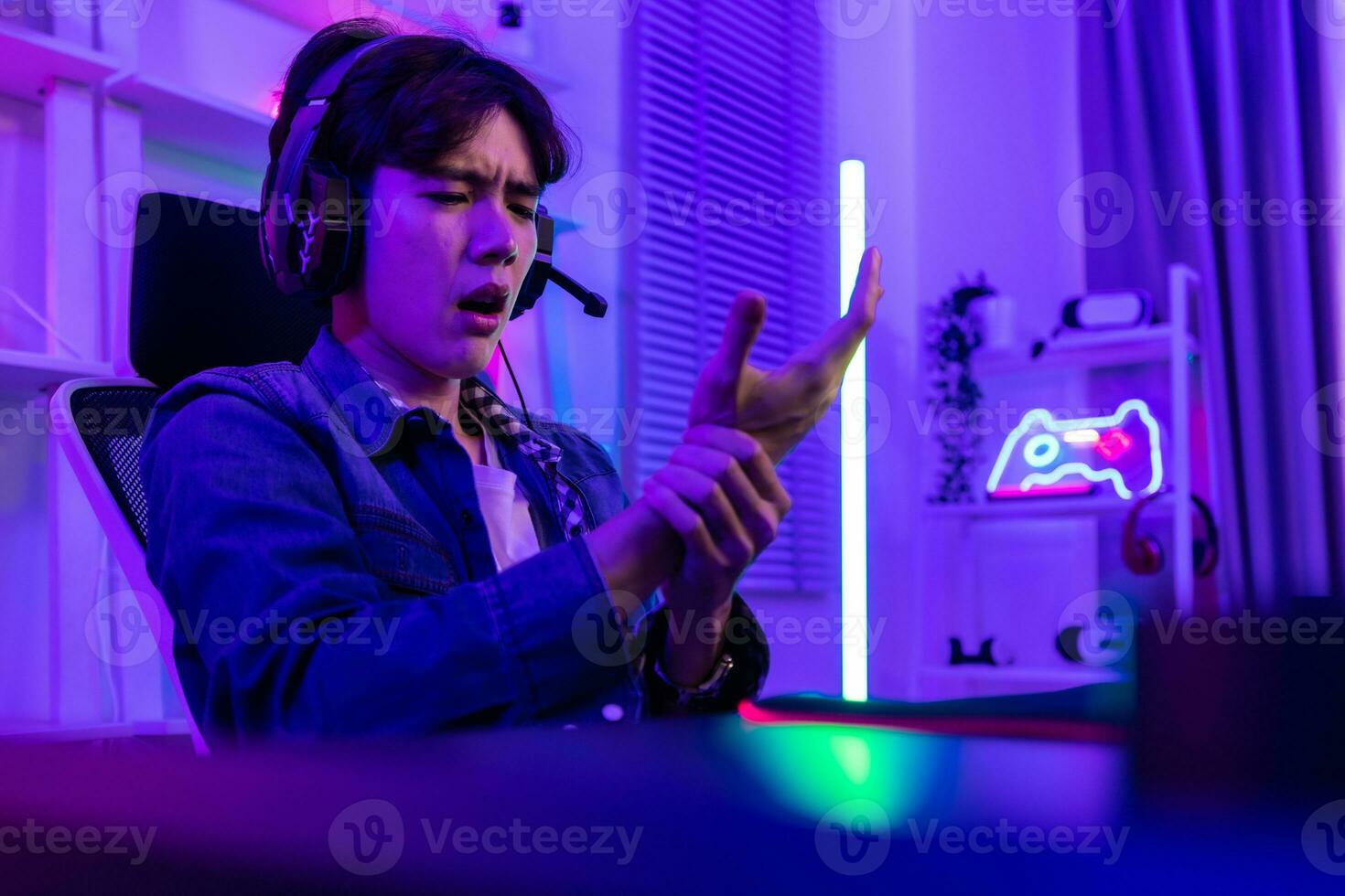 After a lengthy period of practice, professional gamer always get neck, shoulder, back, finger pain. Tired, exhausted ,sleepy are results of repetitive activity. Pro-gamer suffer from office syndrome photo