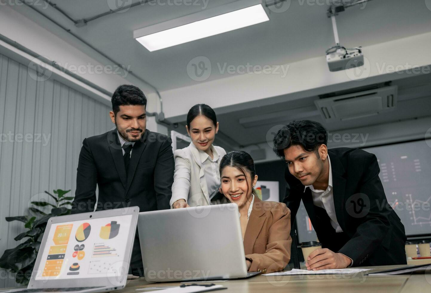 Financial advisors collaborate to assess a company's financial performance using data from its operational activities. Team members work together in a discussions meeting to develop a business plan. photo