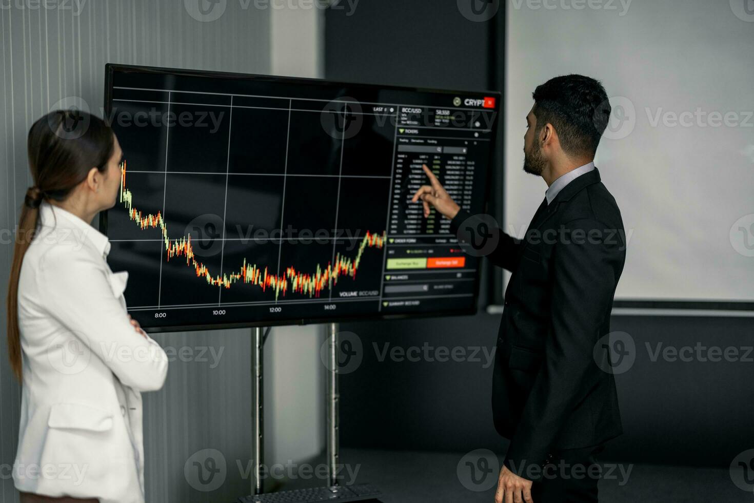 Financial advisors collaborate to assess a company's financial performance using data from its operational activities. Team members work together in a discussions meeting to develop a business plan. photo