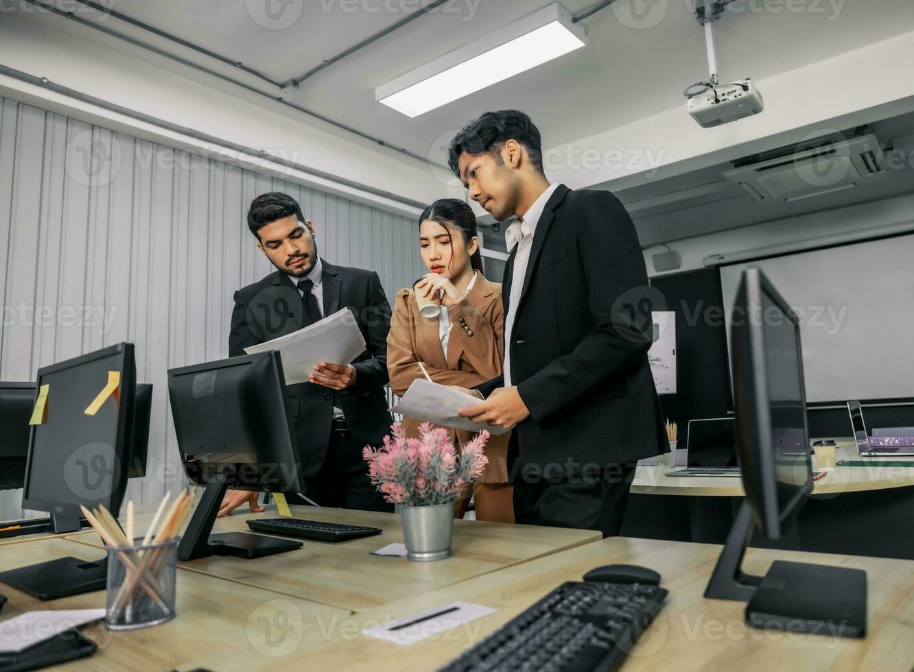 Financial advisors collaborate to assess a company's financial performance using data from its operational activities. Team members work together in a discussions meeting to develop a business plan. photo