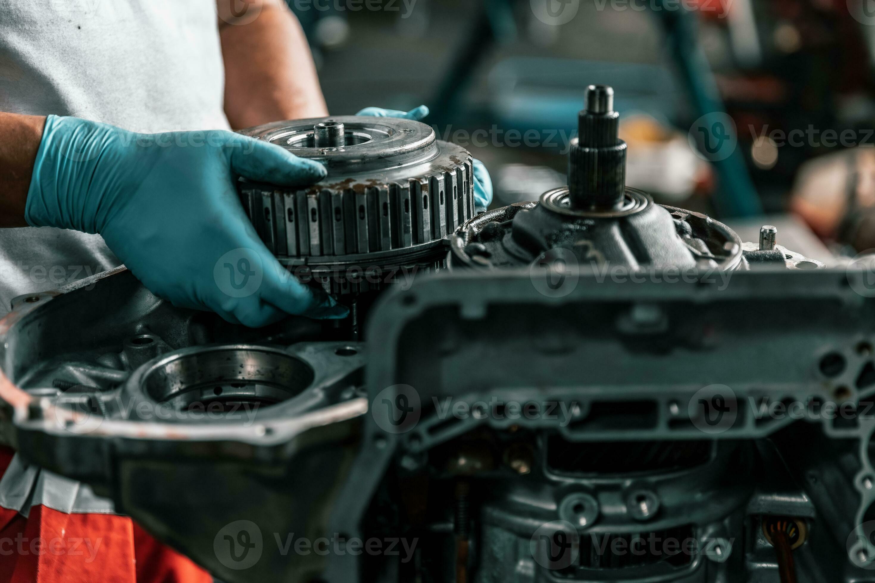 Auto mechanic diagnose and troubleshoots with tools and equipment