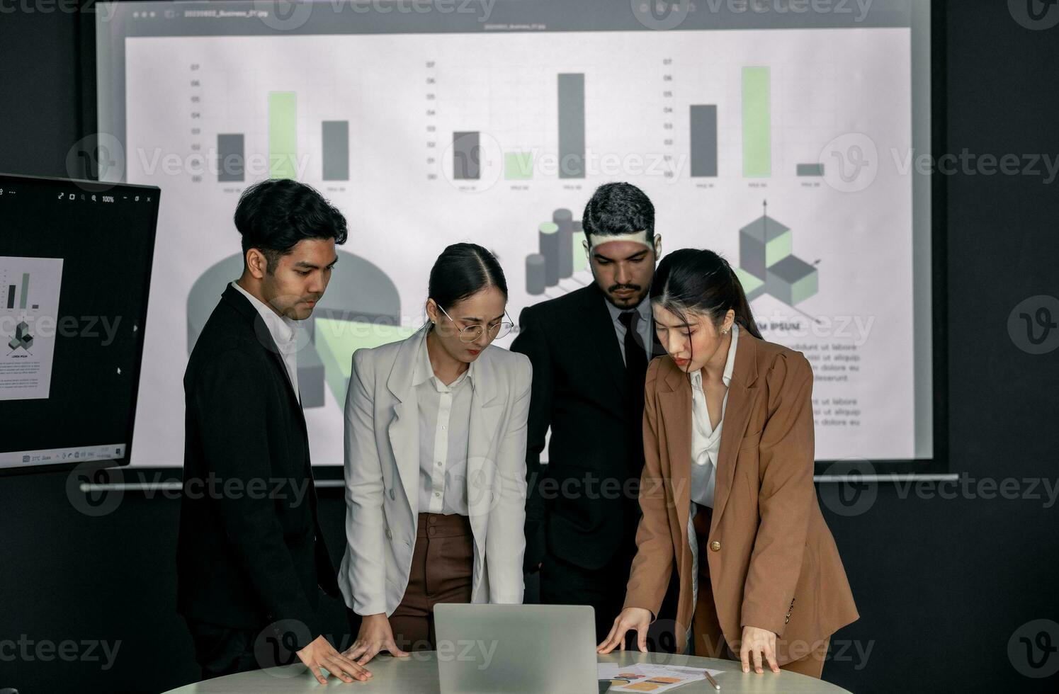 Financial advisors collaborate to assess a company's financial performance using data from its operational activities. Team members work together in a discussions meeting to develop a business plan. photo