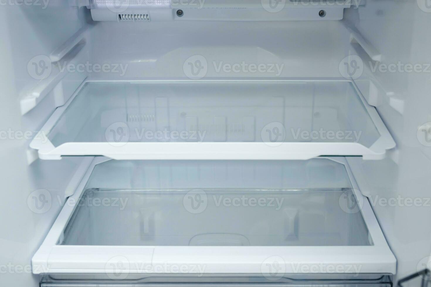 Interior view of the shelf of the refrigerator at home photo