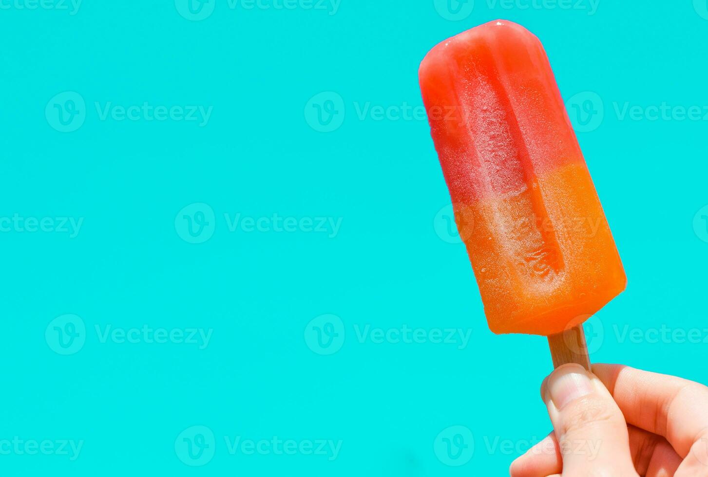 Ice cream in hand with copy space for text. summer background concept photo