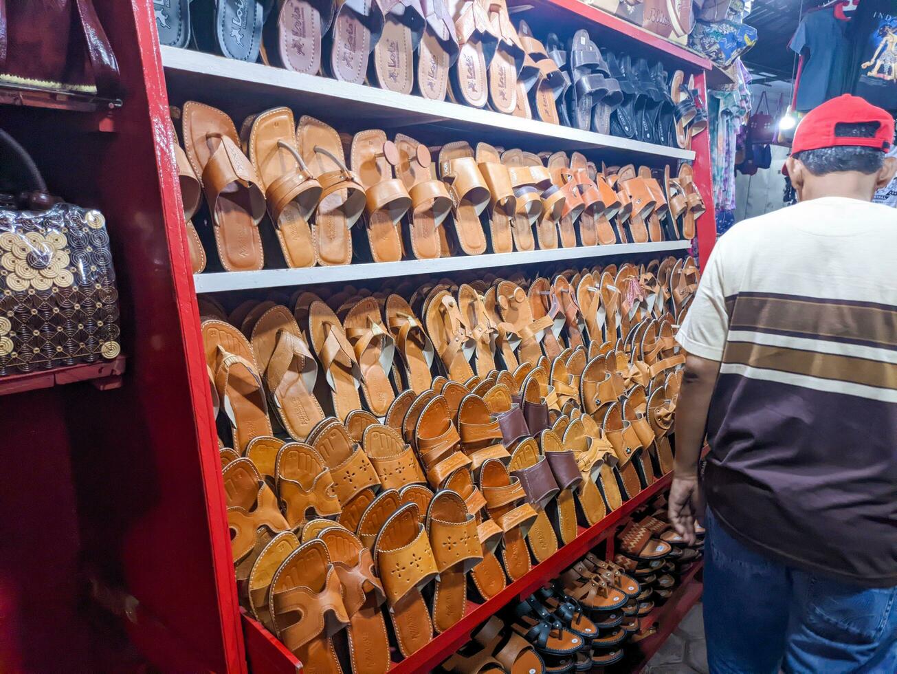 a variety of Blitar special sandal handicrafts that are being displayed for sale photo