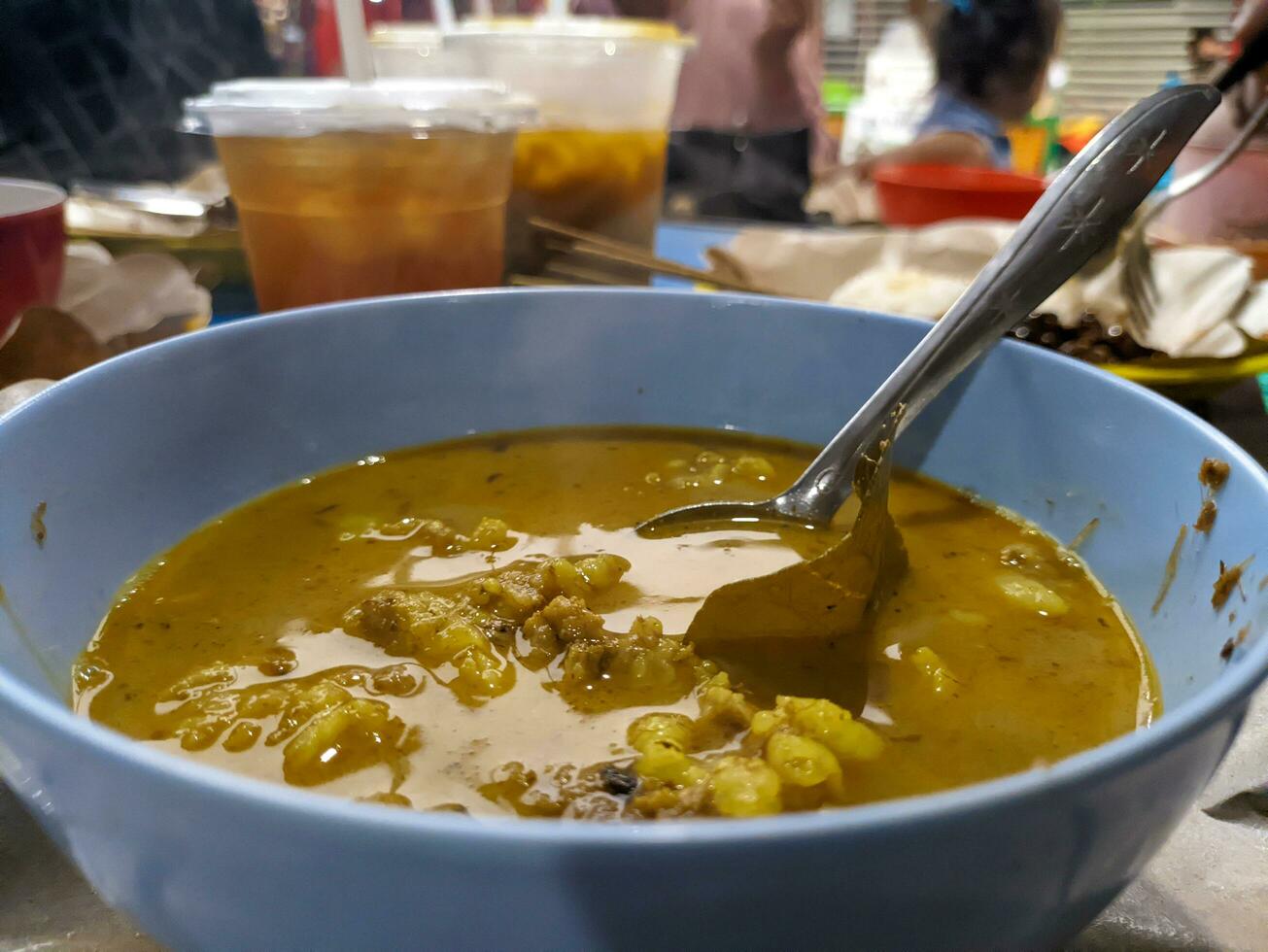 a portion of delicious gulai kambing or goat curry. Indonesian traditional food photo