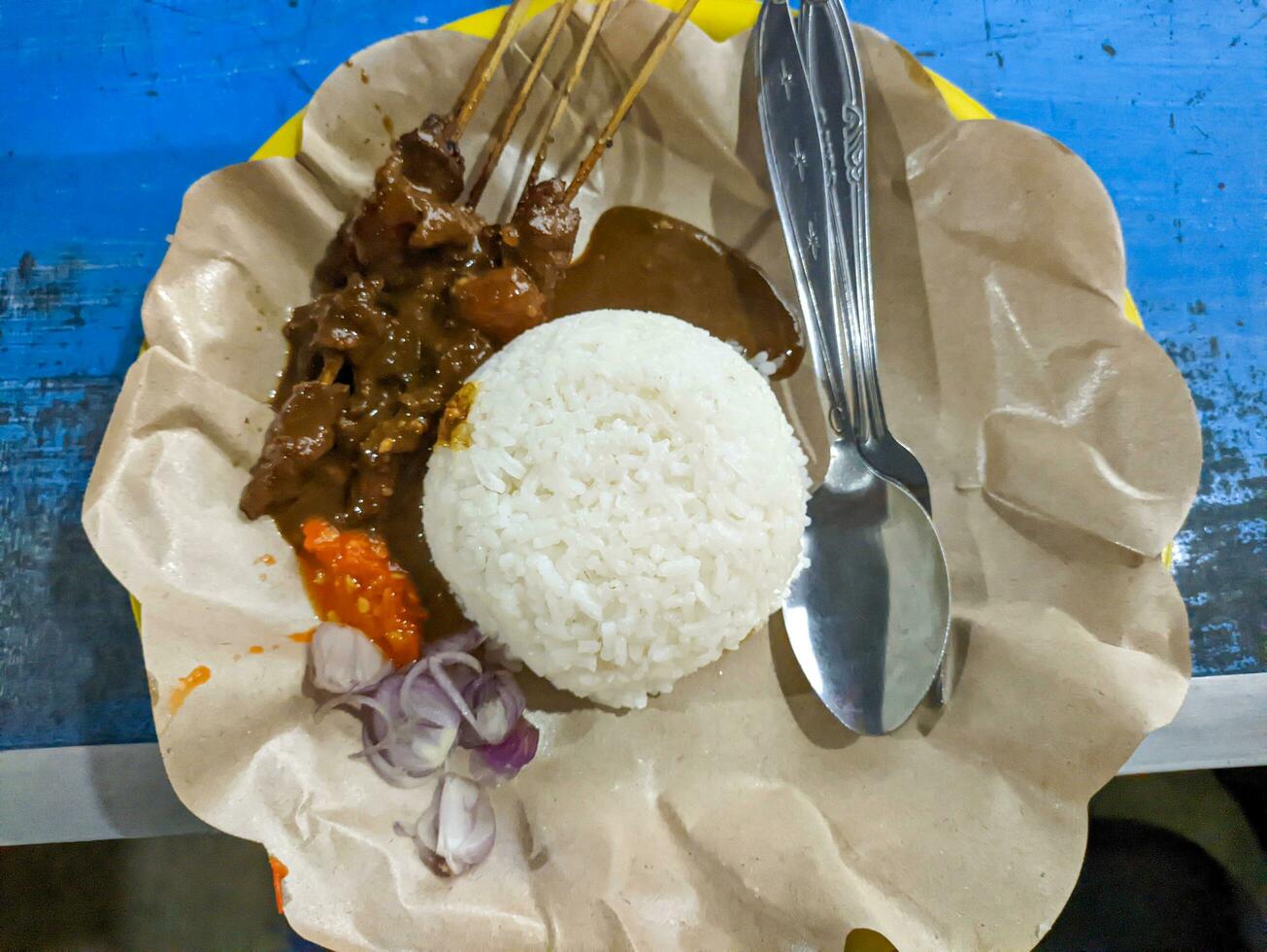 a portion of delicious sate kambing or mutton satay. Indonesian special food photo