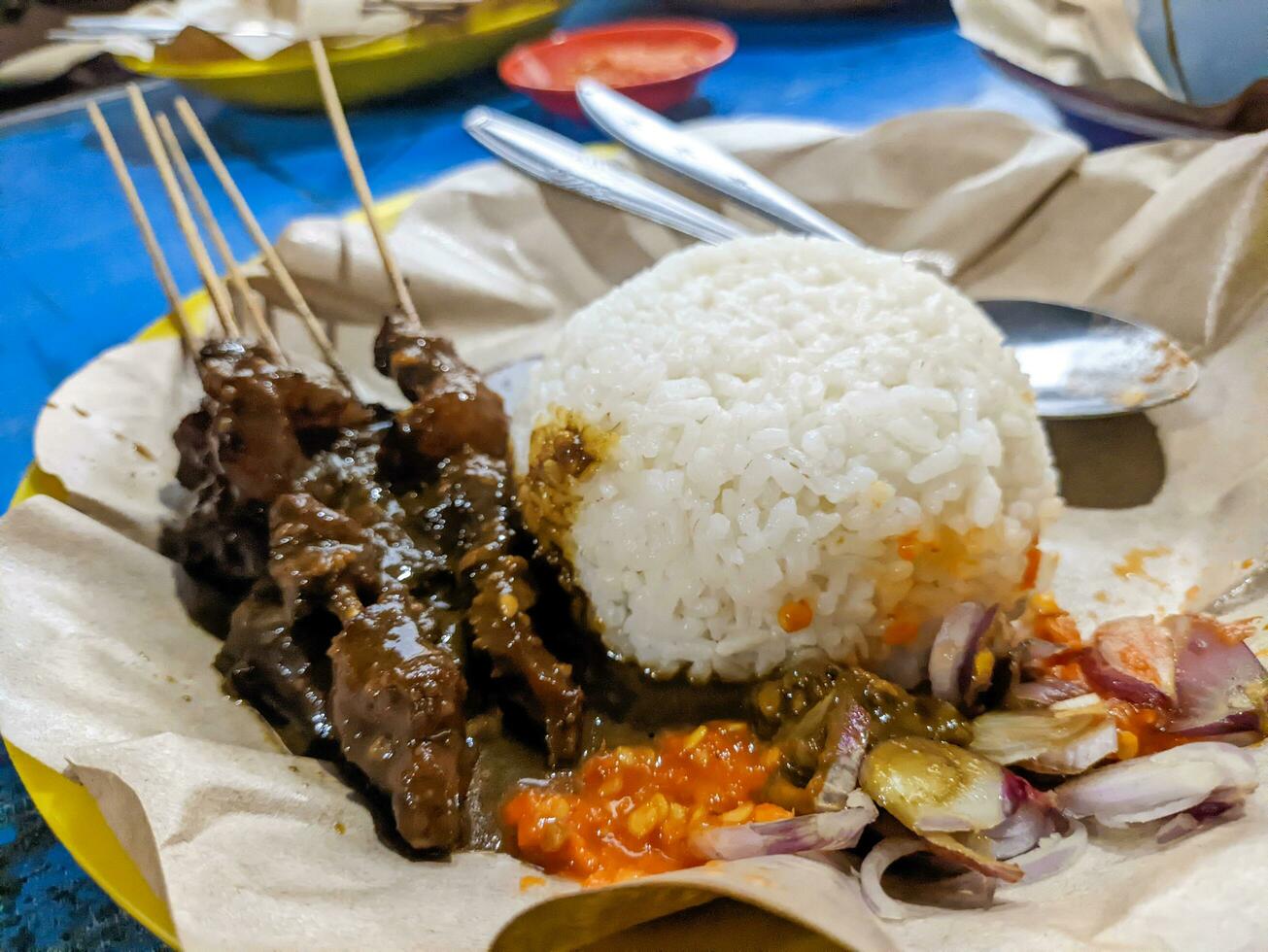 a portion of delicious sate kambing or mutton satay. Indonesian special food photo