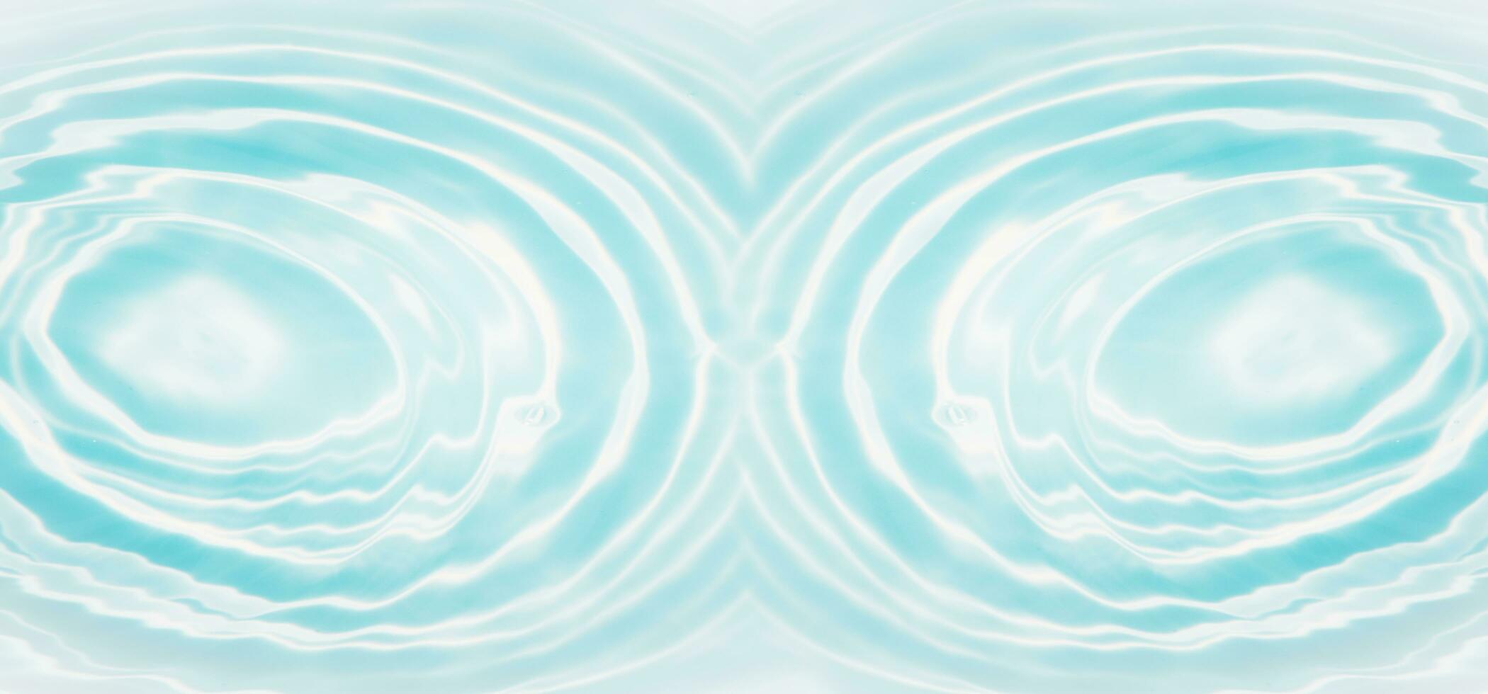 Blue water with ripples on the surface. Defocus blurred transparent blue colored clear calm water surface texture with splashes and bubbles. Water waves with shining pattern texture background. photo