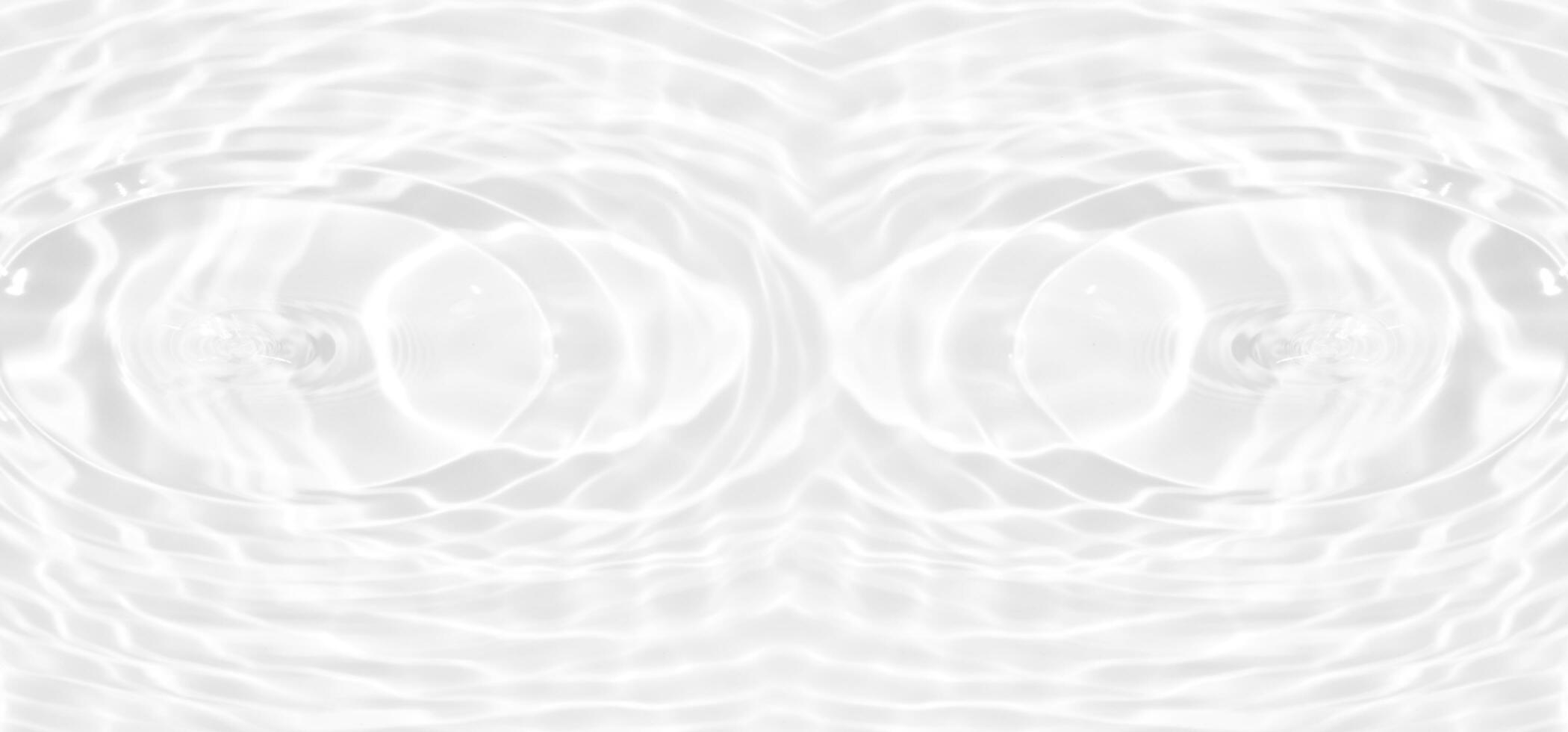 White water with ripples on the surface. Defocus blurred transparent white colored clear calm water surface texture with splashes and bubbles. Water waves with shining pattern texture background. photo