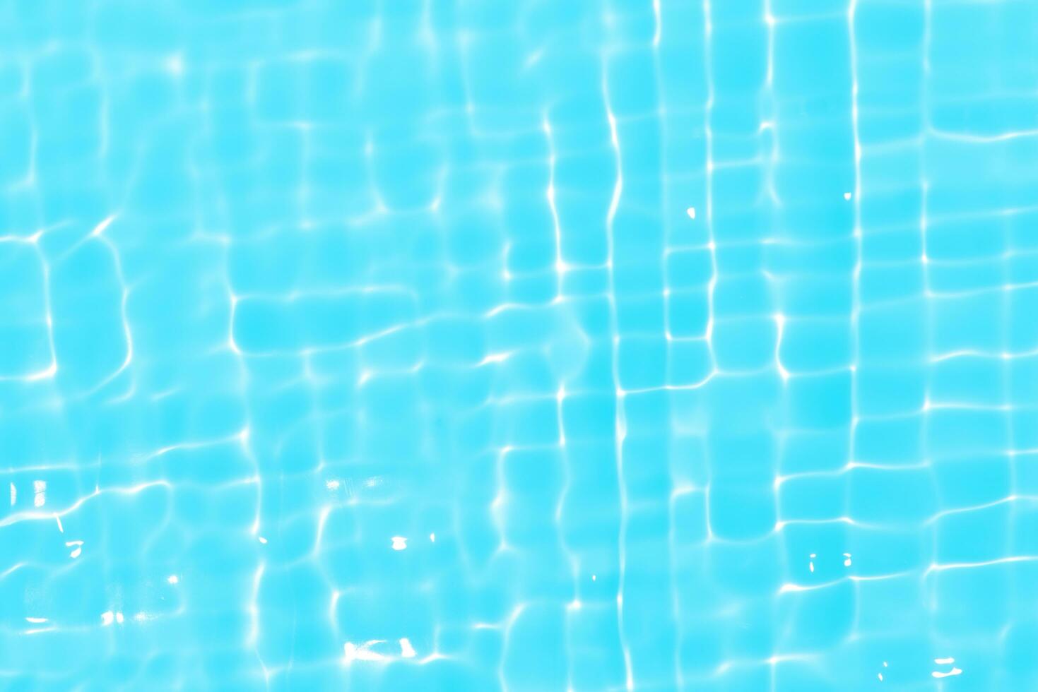 Purple water with ripples on the surface. Defocus blurred transparent pink colored clear calm water surface texture with splashes and bubbles. Water waves with shining pattern texture background. photo