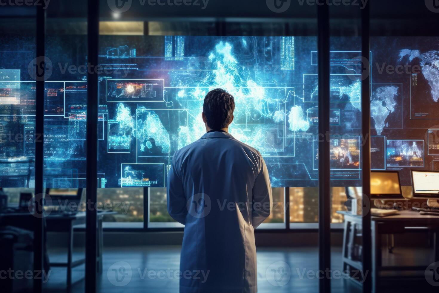 A scientist in a laboratory analyzing data on a computer screen. photo