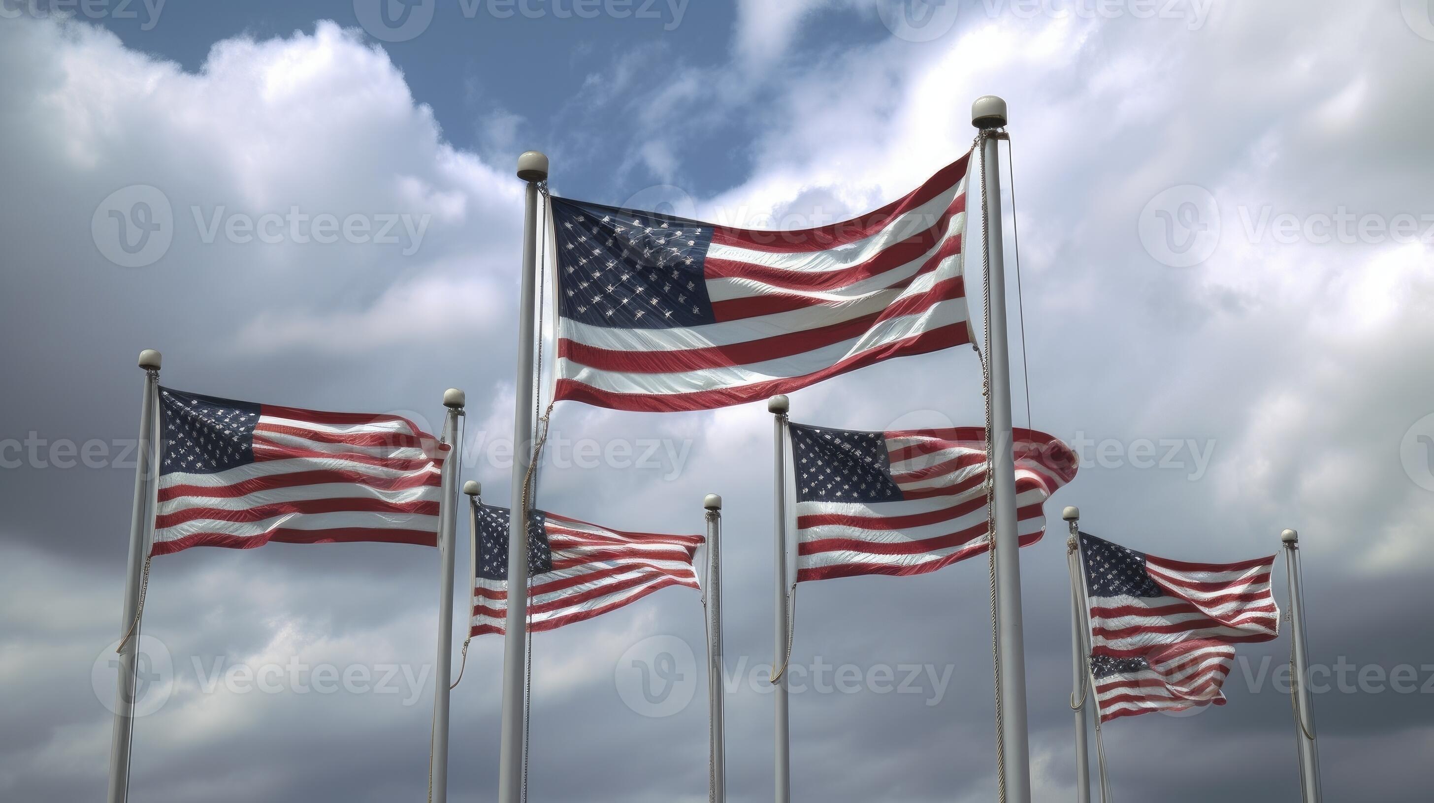 American flags waving in the wind against a blue sky background