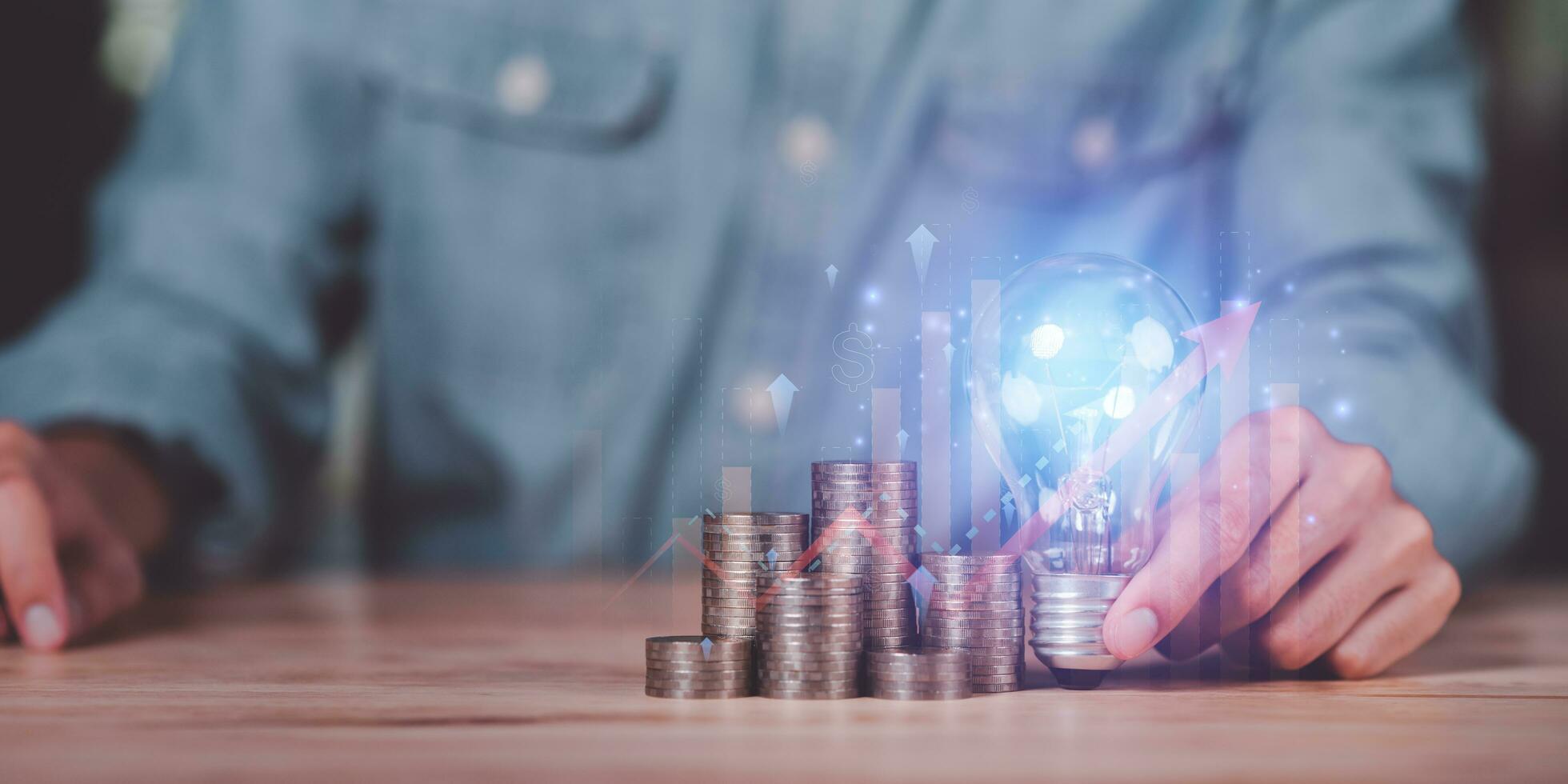 Businessman showing financial and investment concept with light bulb ,profit growth management ,high return investment ,bank interest management ,risk management ,financial planning and investment photo