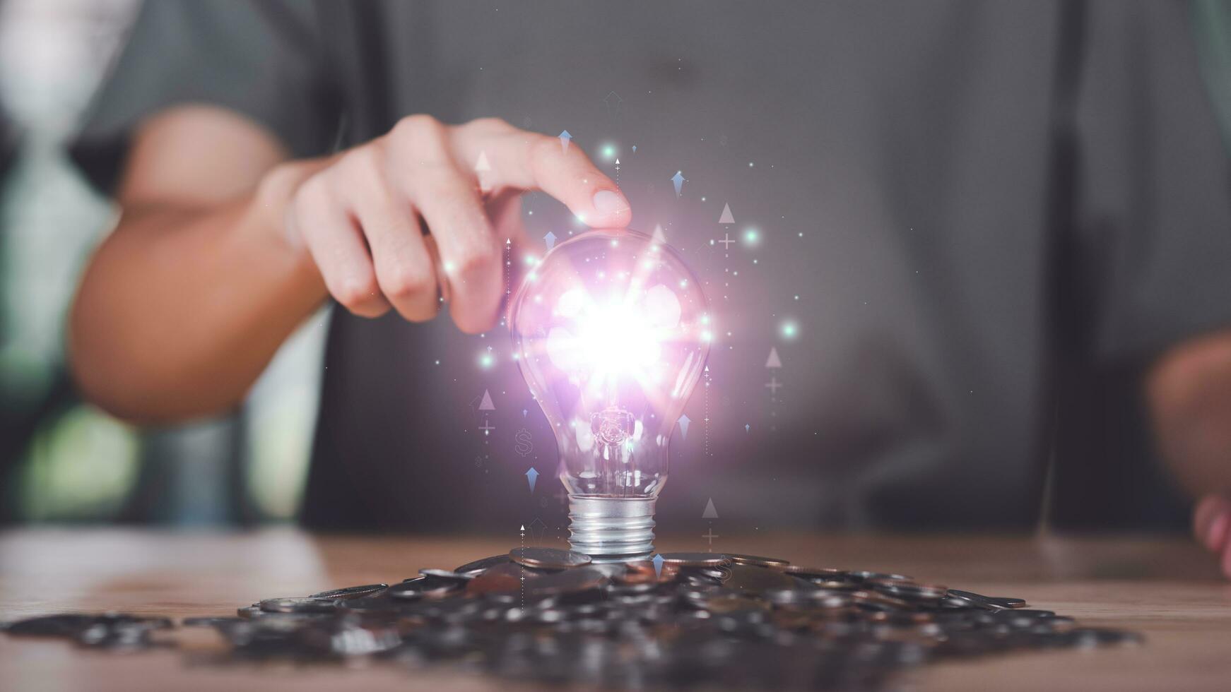 Businessman showing financial and investment concept with light bulb ,profit growth management ,high return investment ,bank interest management ,risk management ,financial planning and investment photo