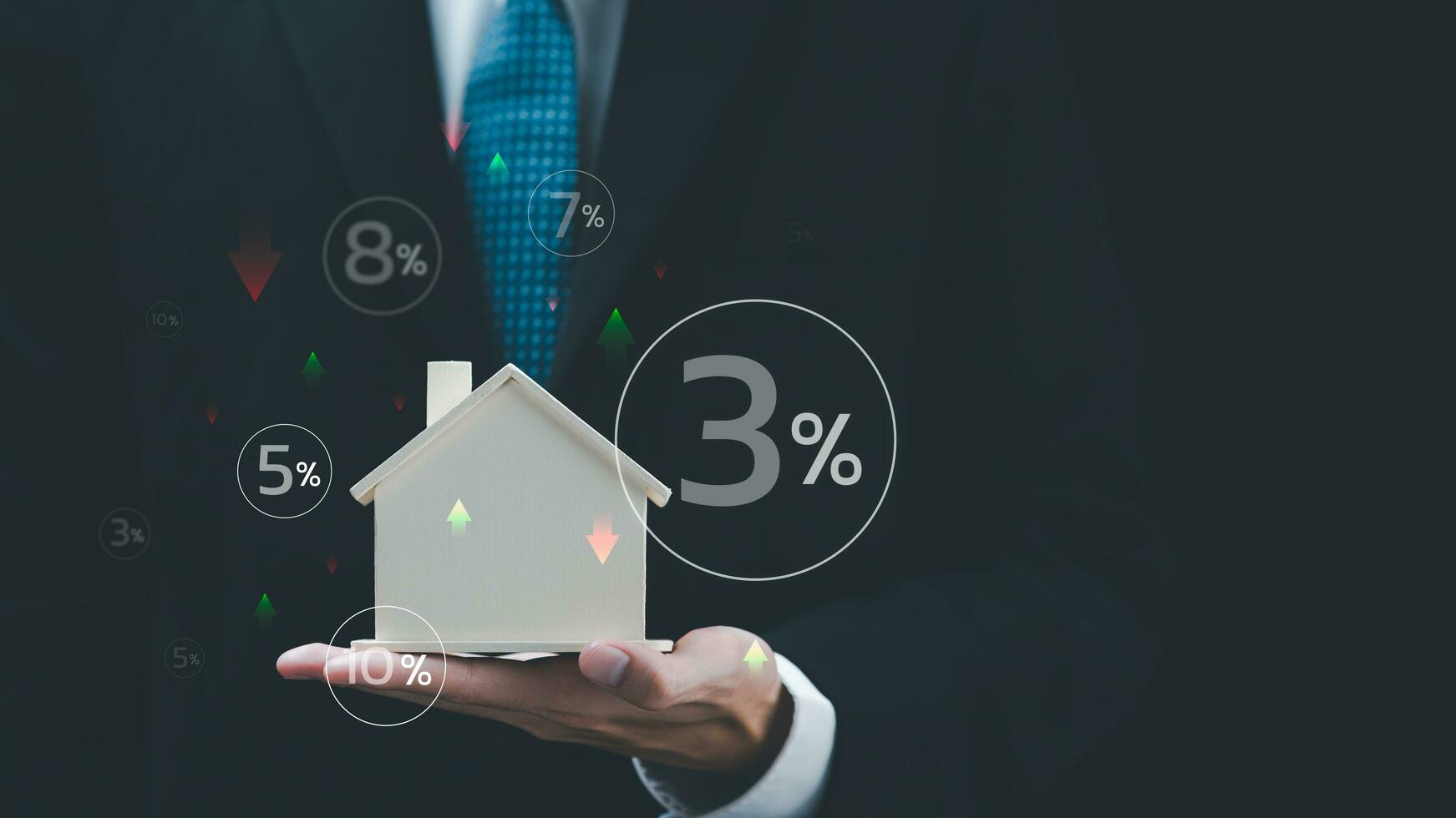 Real estate agent holding model house showing fluctuating interest rate concept ,Financial interest rates ,applying for financial credit ,interest burden ,The rise and fall of loan interest rates photo