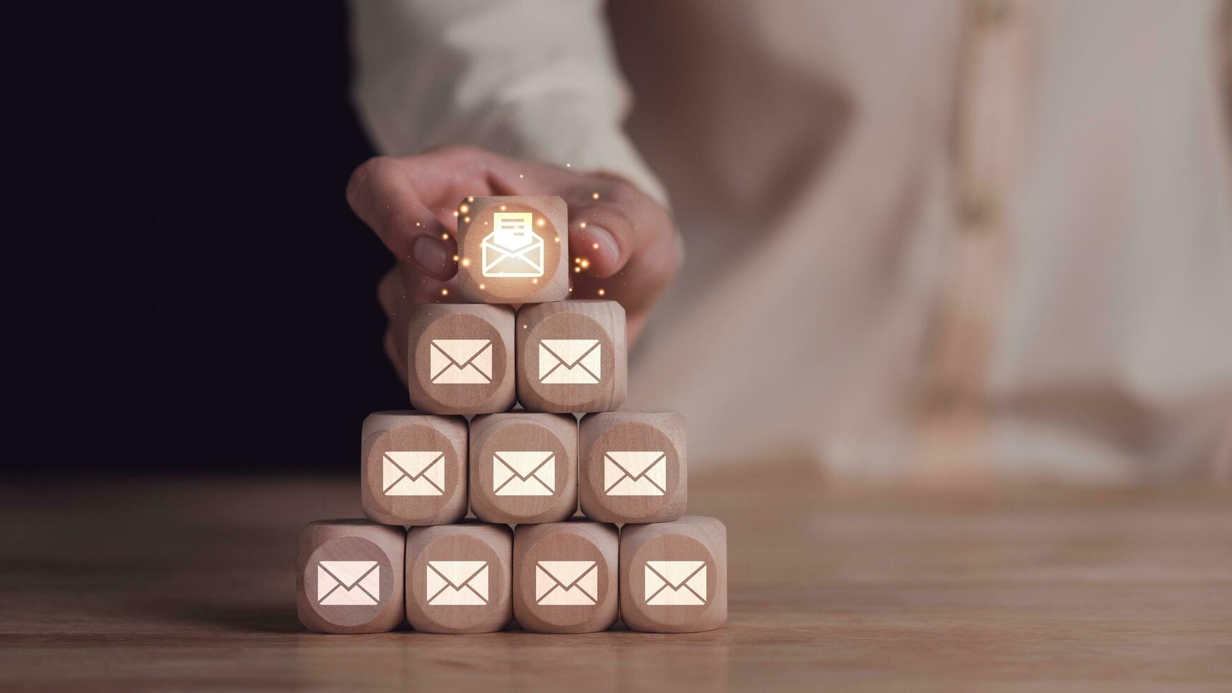 Businessman showing electronic mail communication concept with wooden blocks ,Email marketing and newsletter concept ,Digital communication with email messages ,online marketing strategy photo