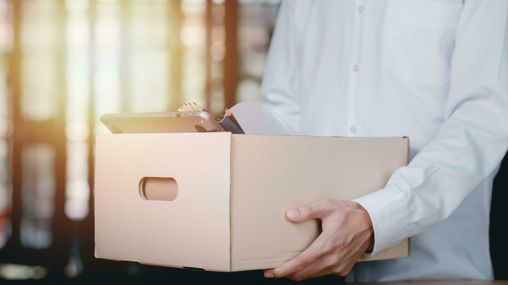 employees or unemployed holding a cardboard box ,Show termination concept ,resigned from a job, was fired or left a job ,recession problems ,bankruptcy in business ,quitting a job photo