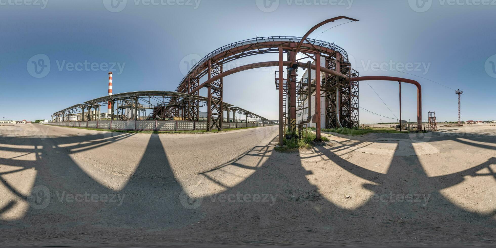 spherical 360 hdri panorama near industrial architecture and communications, pipes and metal structures in equirectangular seamless projection photo