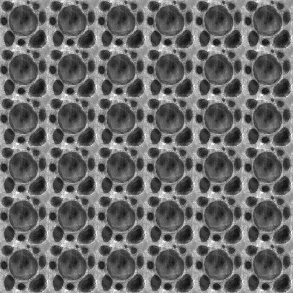 A black and white pattern of circles with a black background photo