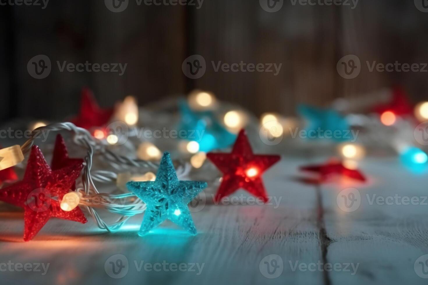 Christmas background with blue light luminous garlands and red stars on a white wooden background with copy space. photo