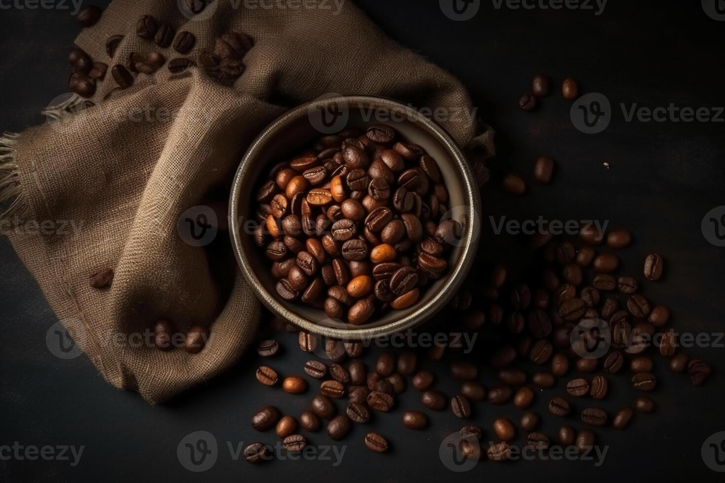 Top view of coffee beans in a sack on dark background. photo