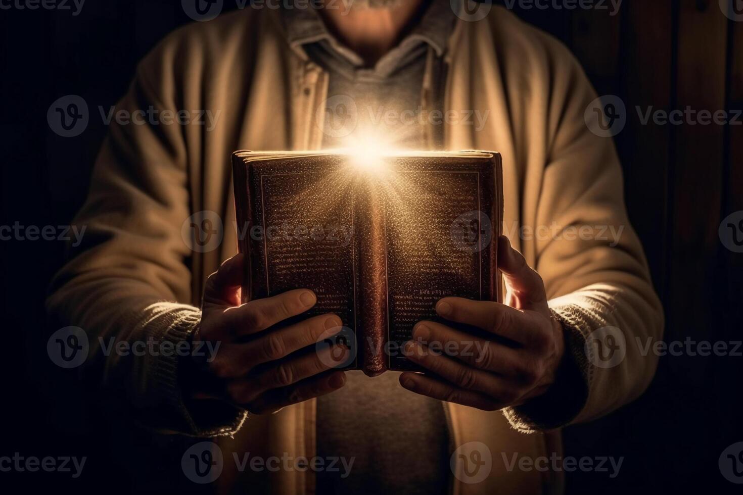 Man is holding and hugging the bible on his chest with atmosphere light. photo