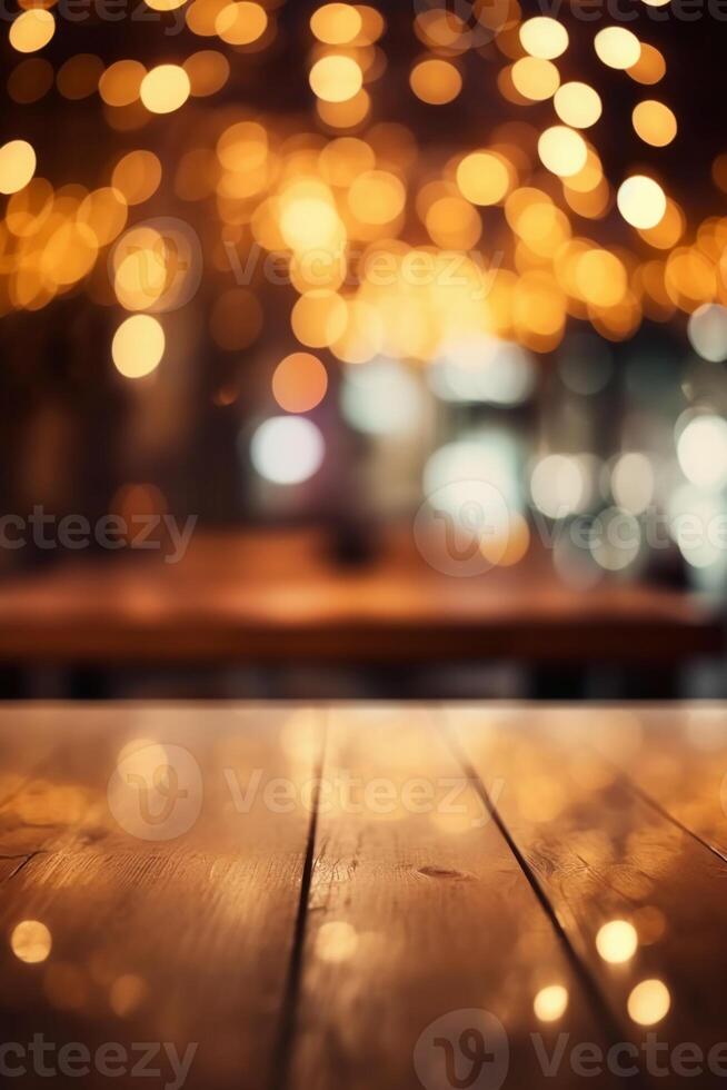 Image of wooden table in front of abstract blurred background of restaurant lights. photo