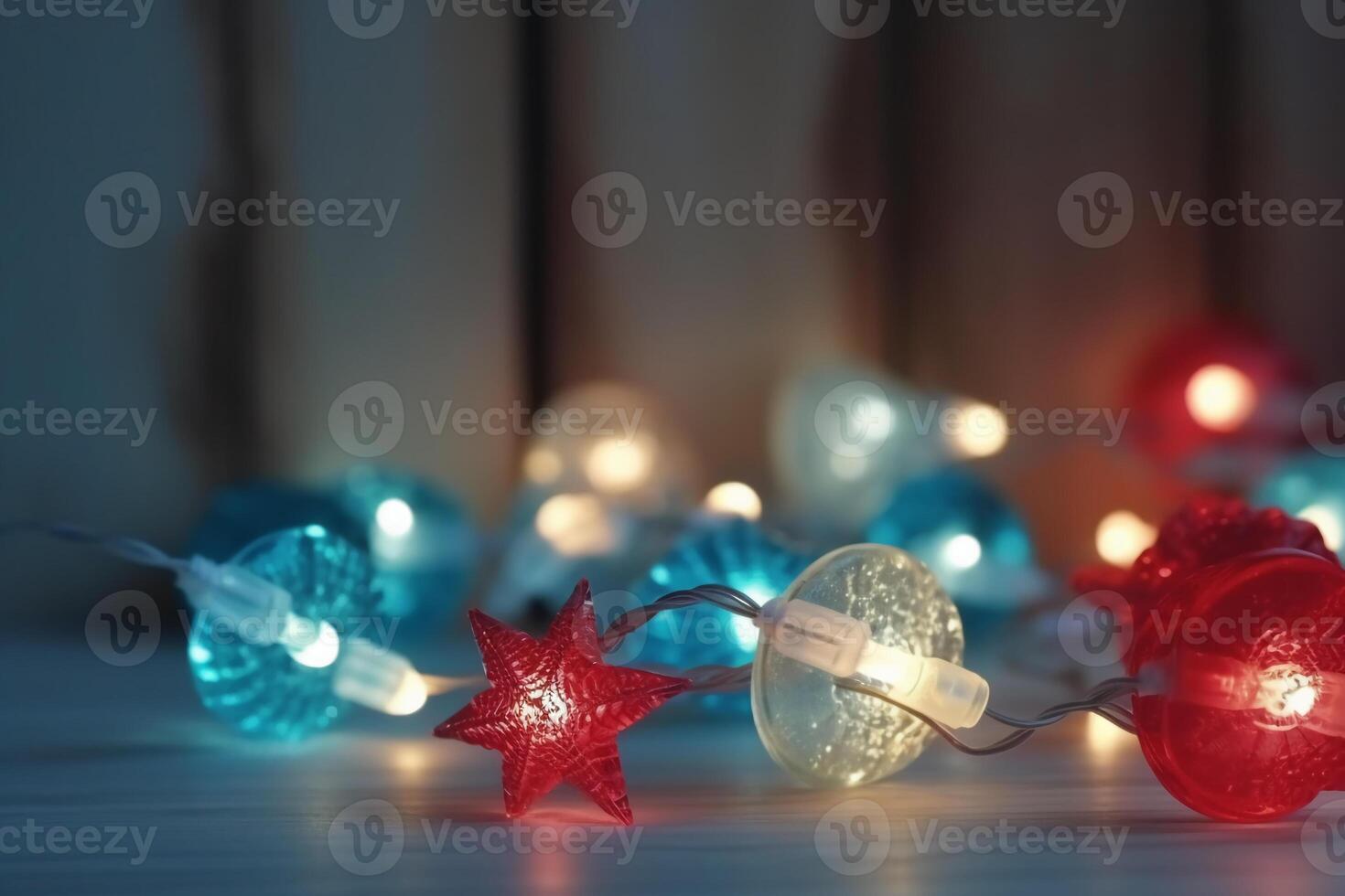 Christmas background with blue light luminous garlands and red stars on a white wooden background with copy space. photo