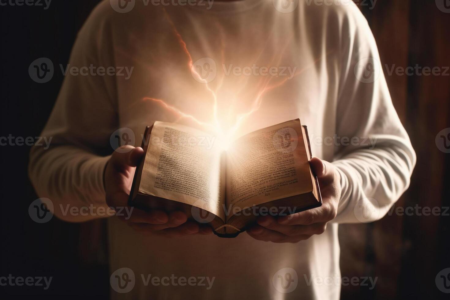 Man is holding and hugging the bible on his chest with atmosphere light. photo