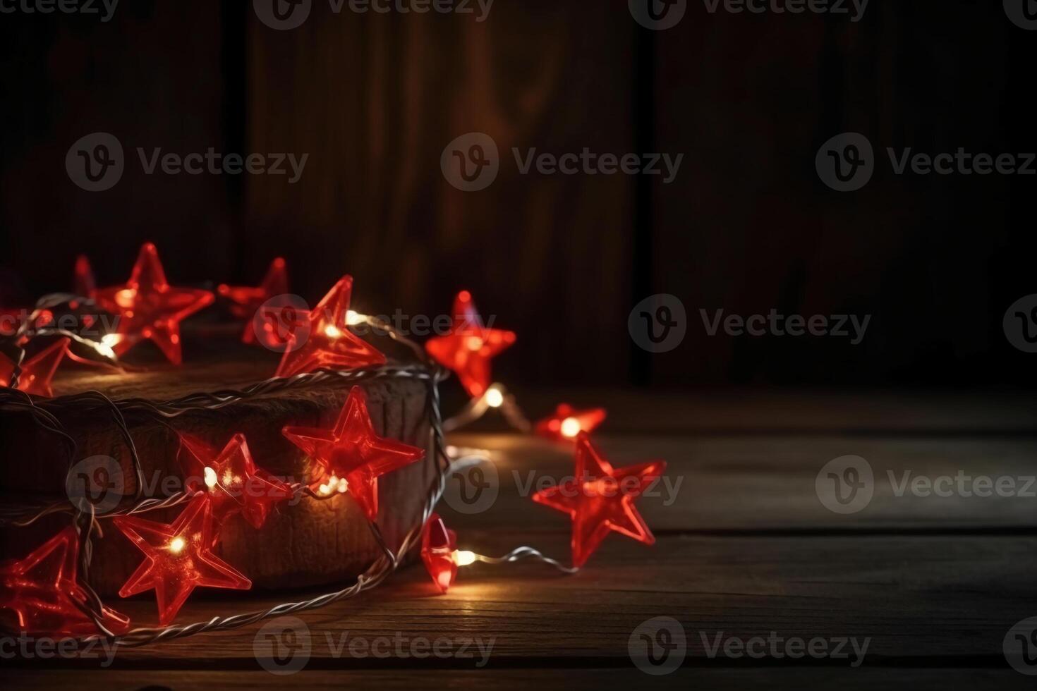 Christmas background with blue light luminous garlands and red stars on a white wooden background with copy space. photo