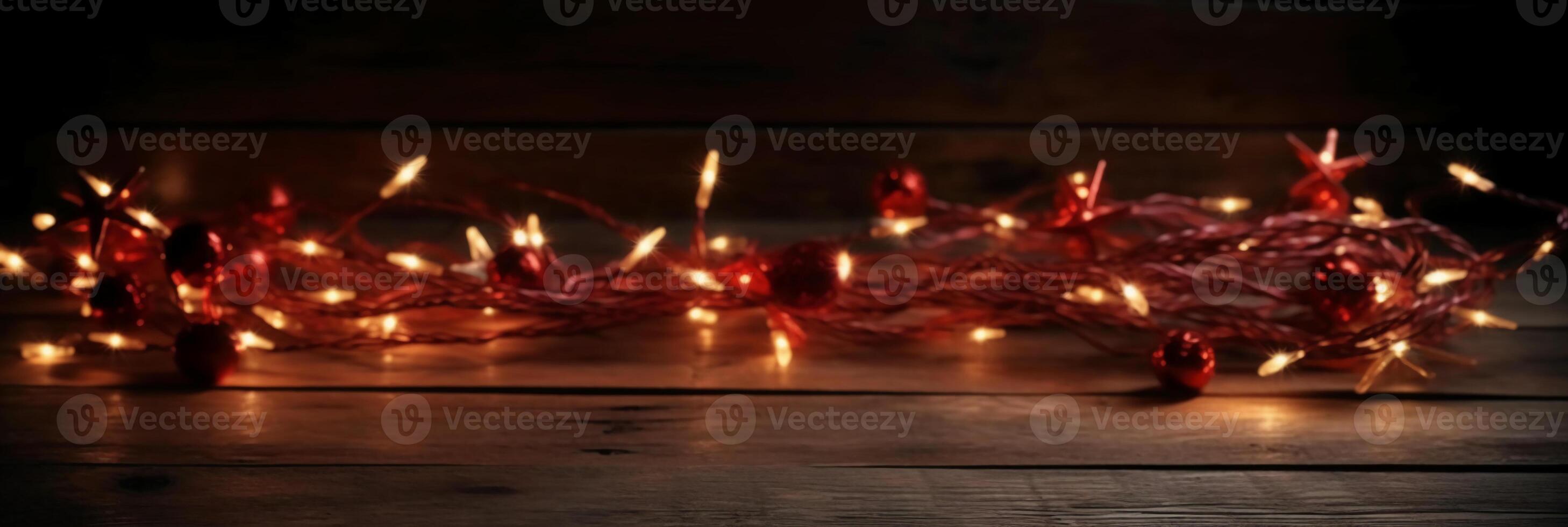 Christmas background with blue light luminous garlands and red stars on a white wooden background with copy space. photo