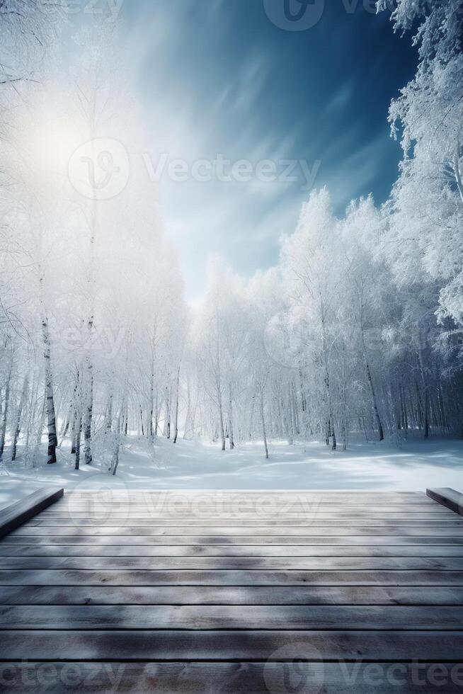 Winter Christmas scenic landscape with copy space. Wooden flooring, white trees in forest covered with snow, snowdrifts and snowfall against blue sky in sunny day photo