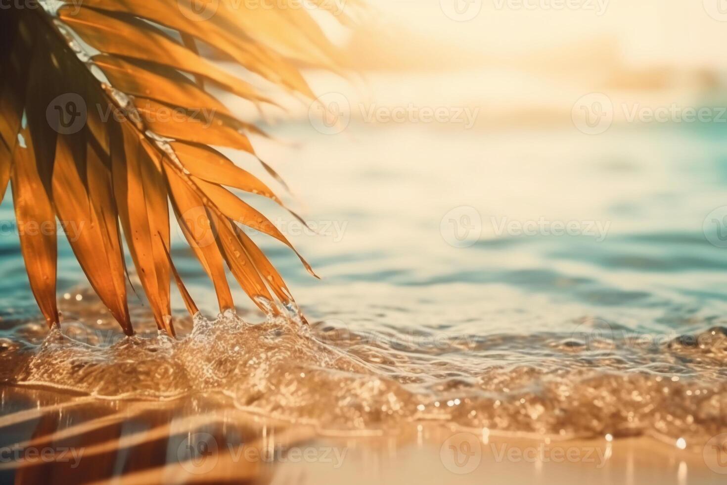 Beautiful background for summer vacation and travel. Golden sand of tropical beach, blurry palm leaves and bokeh highlights on water on sunny day. photo