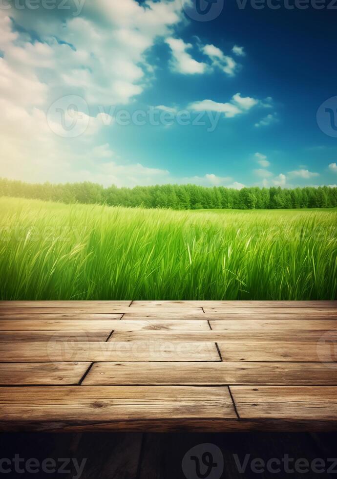 Spring summer beautiful background with green juicy young grass and empty wooden table in nature outdoor. Natural template landscape with blue sky and sun. photo