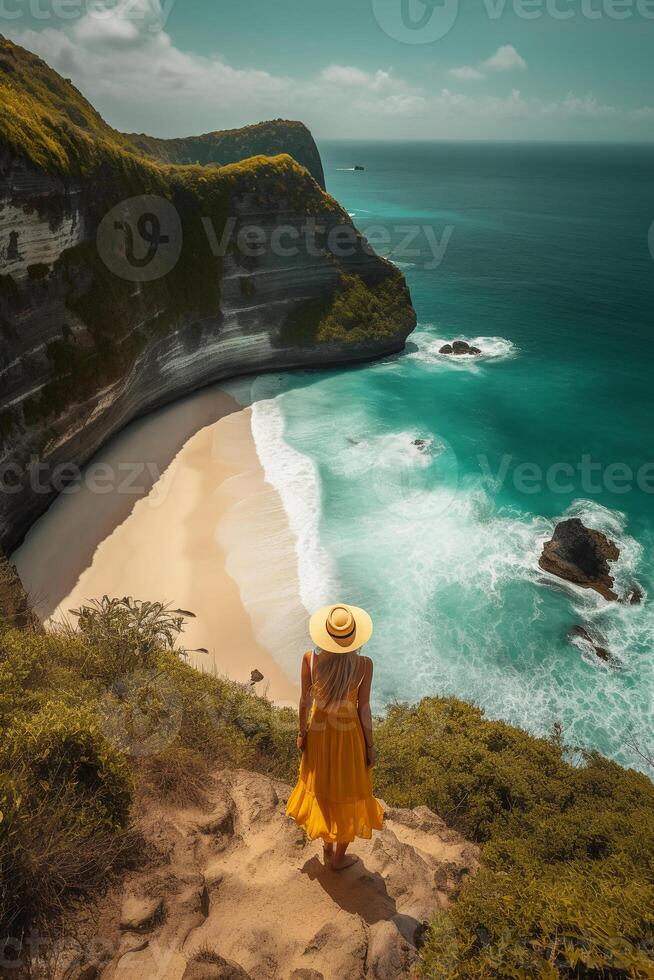 Standing woman wearing summer yellow look, Best Beaches. photo