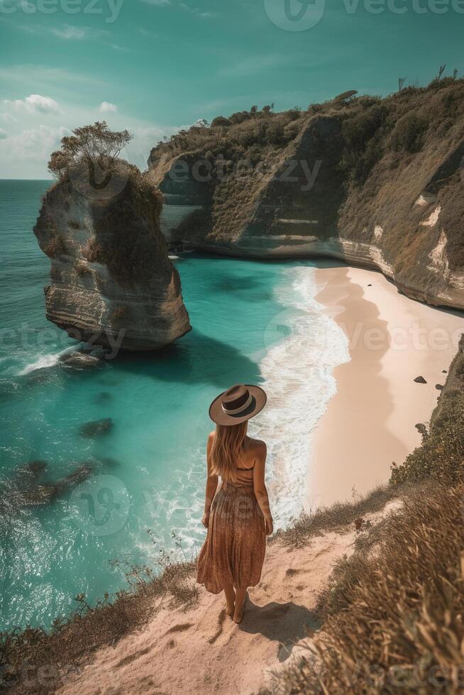 Standing woman wearing summer yellow look, Best Beaches. photo